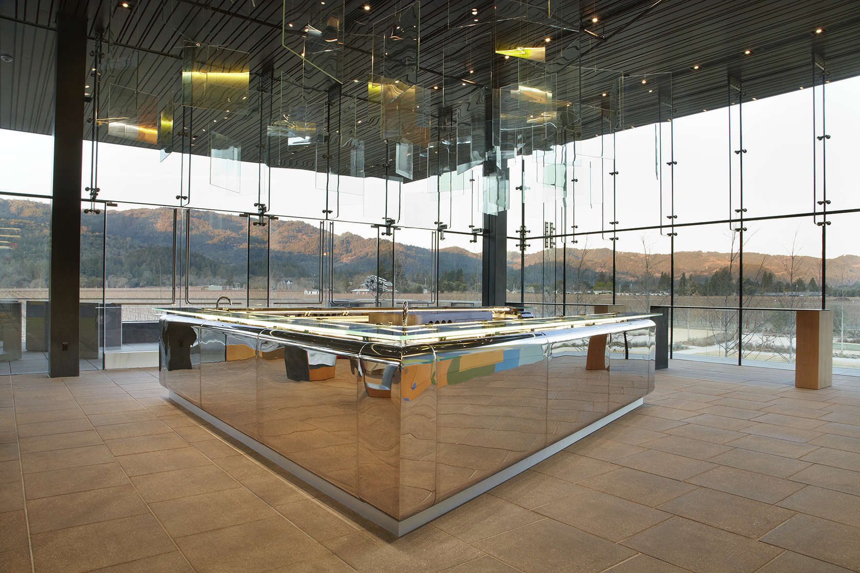 Hall Winery approached NICOLEHOLLIS for the interior design of its new St. Helena winery complex. A highlight is the custom 23-foot mirror-polish bar. 