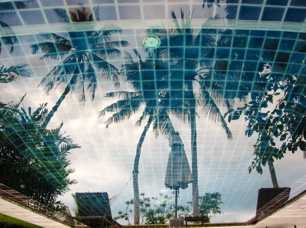 Palms reflected in the private pool of the Beachfront Pool Villa King at the Moevenpick Resort Laem Yai Beach Samui . photo: the art resort