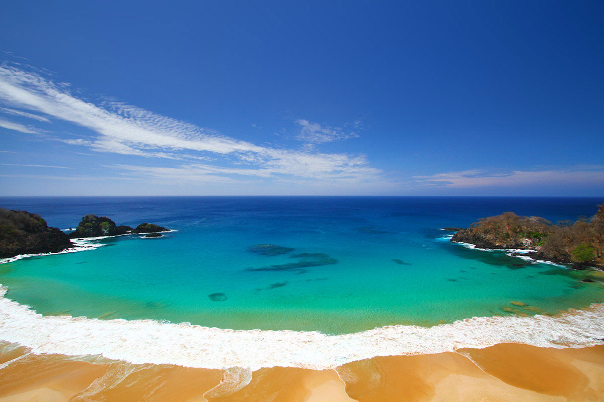 Baia do Sancho, located on the Fernando de Noronha archipelago, a perfectly shaped crescent of soft sand, framed by cliffs. photo via summerfashion.co.uk