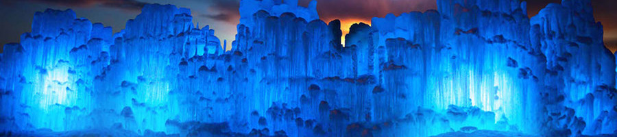 The Lincoln Ice Castle New Hampshire. The glacial wonderland is illuminated by night. Photo Ken Skuse.